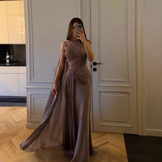 Elegant greyish purple sleeveless long dress with ribbon detail. Mid-waist fit, made from polyester, perfect for casual or formal occasions.