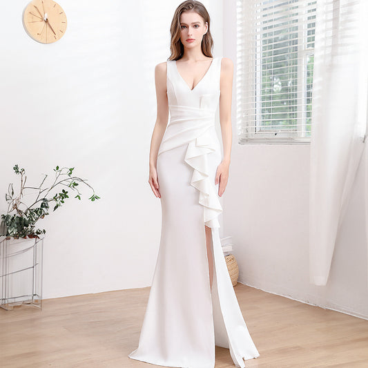 Elegant sleeveless mid-waist dress with zipper detail. Available in white, red, dark green, black, wine red, purple blue, and pink. Sizes S–XXL.