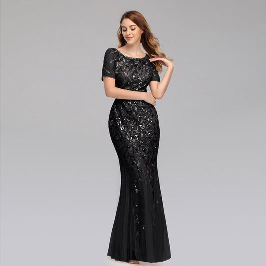 Graceful floor-length dress with a classic round neck, delicate lace, and intricate embroidery. Perfect for evening events, weddings, and special occasions.