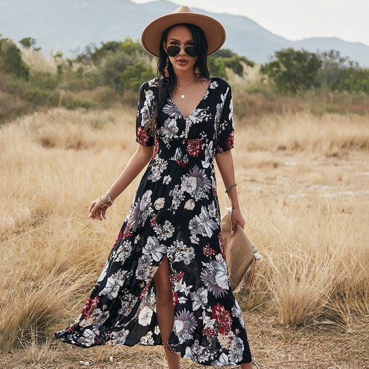 Stylish printed V-neck midi dress with a high waist and large flowy hem. Soft, comfy fabric in yellow, black, and blue. Sizes S–XXL.