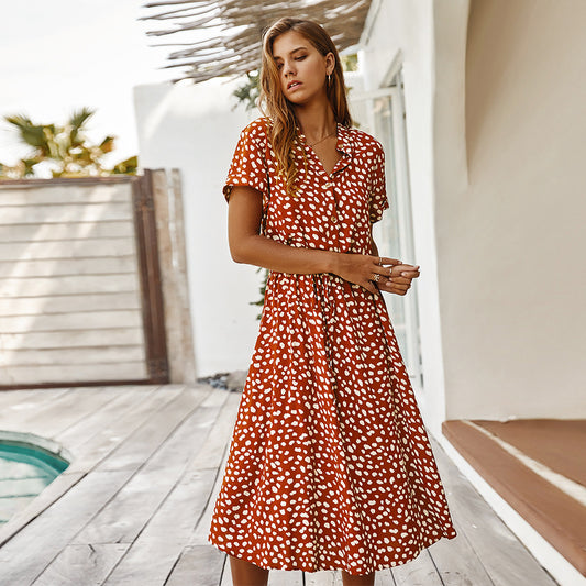 Chic polka dot dress with a high waist and short sleeves. Soft rayon-cotton blend for breathable comfort. Perfect for summer. Stylish and flattering.