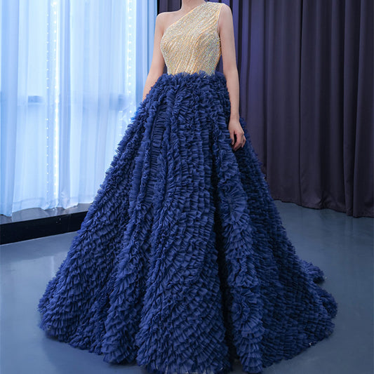Chic blue one-shoulder dress with a puffy skirt and medium waist. Perfect for casual days or semi-formal events. Stylish, flattering, and comfortable.