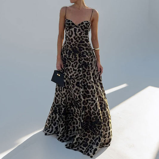 Bold leopard print suspender dress in breathable polyester. Chic commuter style for everyday wear. Sizes S–3XL. Fashion-forward and flattering.