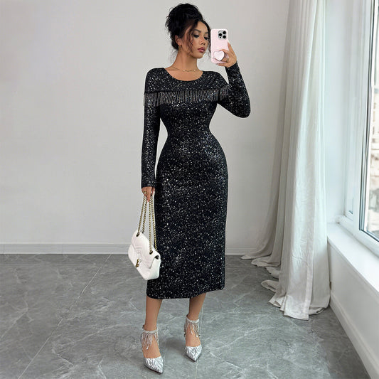 Elegant black dress with shimmering sequins and long sleeves. Mid-waist pullover design made from polyester. Perfect for parties and evening events. S–XL.