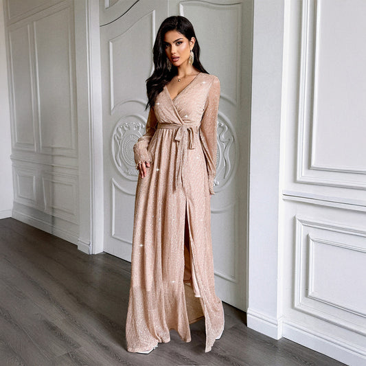 Sparkling sequin dress with lace-up detail and bell sleeves. Adjustable waist for a perfect fit. Available in black, wine red & champagne. Sizes S–XL