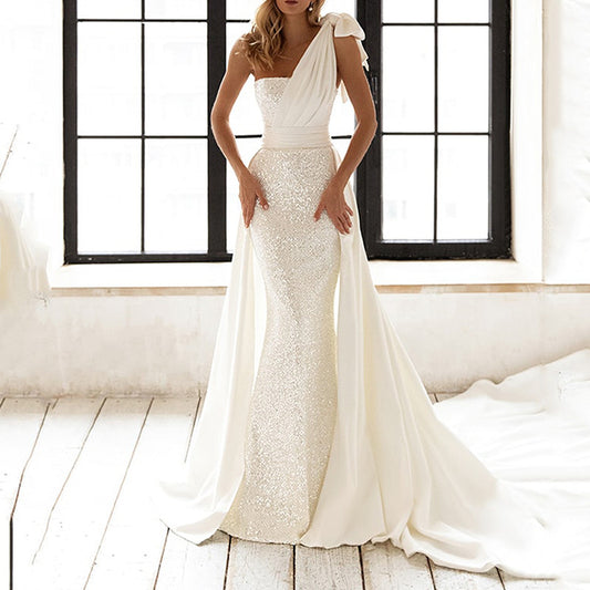Elegant white lace dress with high-waist fit and sequined details. Sleeveless one-step skirt design, perfect for temperament commute or special occasions. Sizes S–XXL.