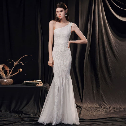 Sophisticated sleeveless wedding dress crafted from premium polyester with a mid-waist design, zipper closure, and high-temperature shaping. Available in white, dark green, black, gold, and wine red. Sizes S–XXL