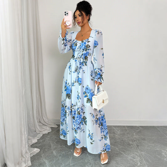 Blue floral print dress with mid waist and long sleeves. Lightweight polyester fabric, perfect for casual or semi-formal occasions. Sizes S–XL.