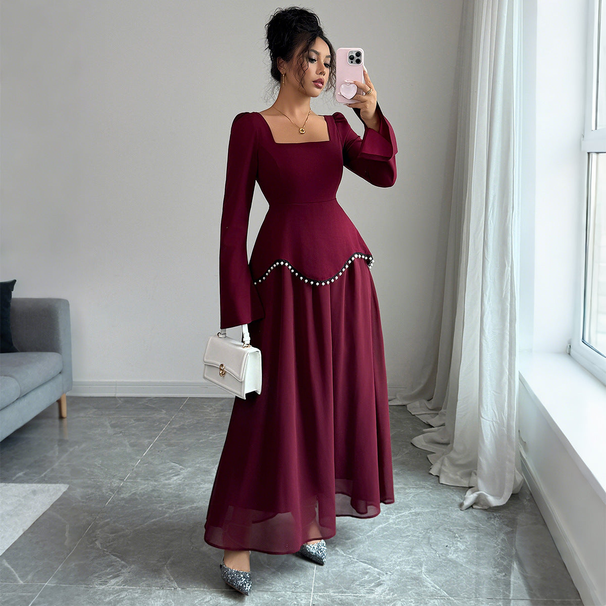 Elegant purplish red bell sleeve dress with long sleeves and mid waist fit. Perfect for both casual and dressy occasions. Sizes S–XL. Lightweight polyester.