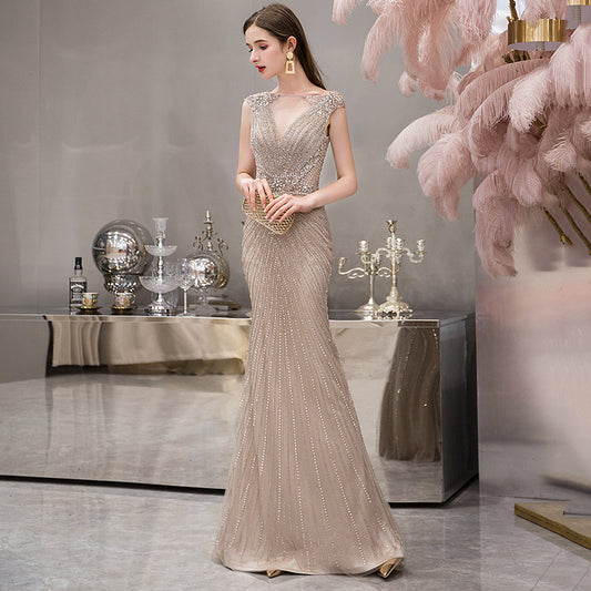 Turn heads with our sleeveless fishtail dress, featuring a flattering mid waist, elegant silhouette, and premium polyester blend. Available in Cameo Brown, Gray, and Champagne – sizes S to XL. Perfect for evening occasions and formal events.