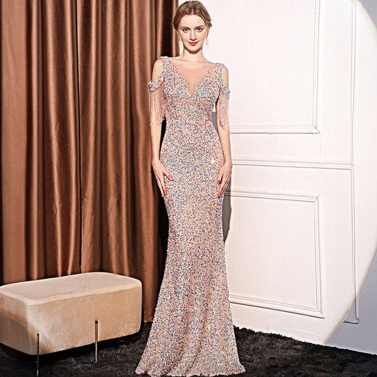 Chic sleeveless polyester dress with dazzling rhinestones and zipper detail. Available in white, black, wine red, champagne, and pink. Sizes S–XXL.