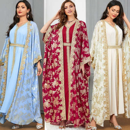 Stylish long dress with belt and gold-plated accents. Available in red, apricot, and light blue. Sizes M–XXL. Elegant polyester maxi dress.
